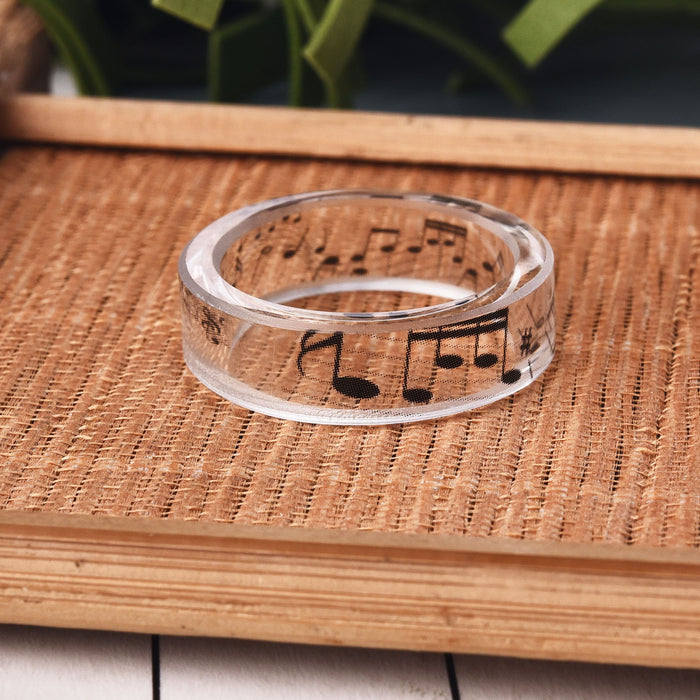 Women's 6.5mm 'Musical Notes' Clear Acetate Acrylic Ring