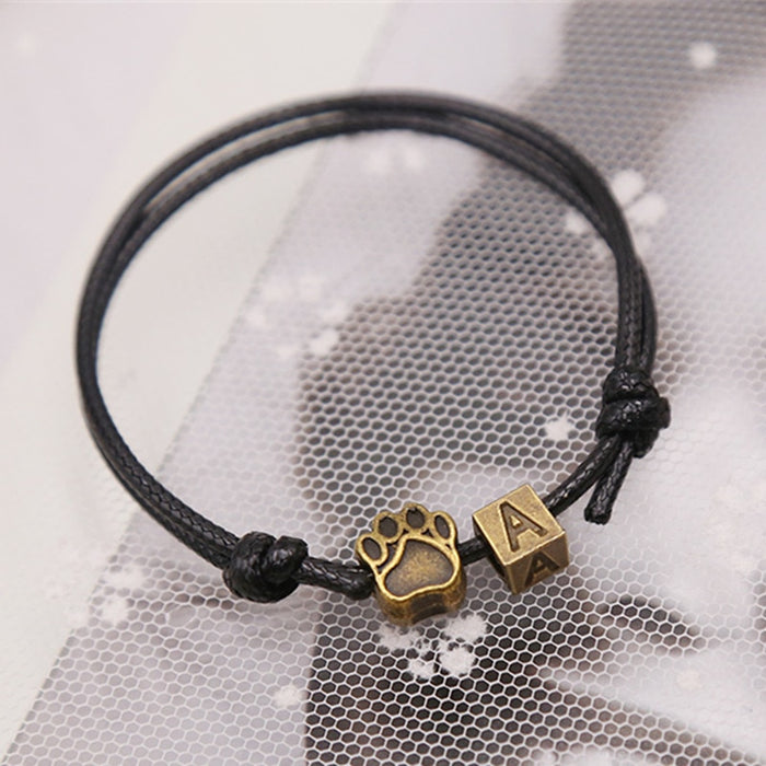Bronze Puppy Paw And Letter Charm Leather Bracelet