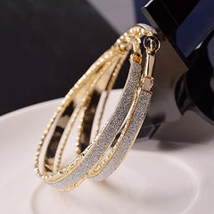 White Rhinestone Encrusted Gold Clasp Hoop Earrings